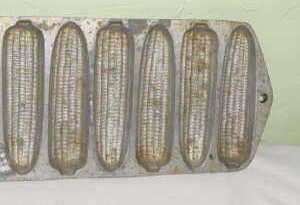   loaf tray the mold form depicts small ears of corn on the cob right