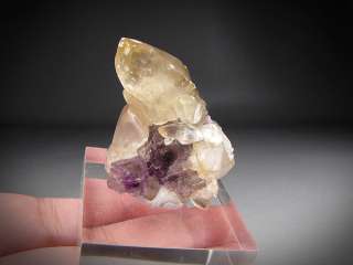   description here you see a nice clear fluorite cube with a purple core