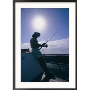  Silhouette of a Man Holding a Fishing Pole Framed 